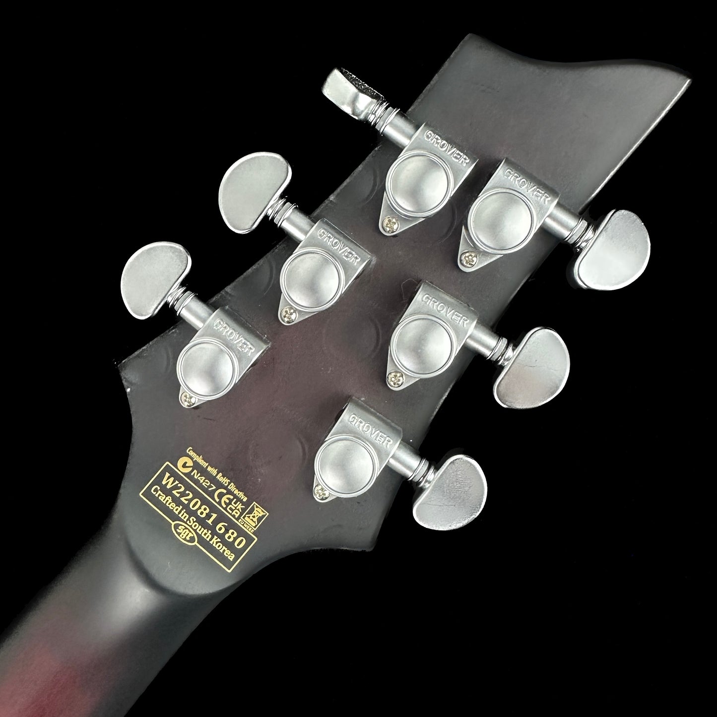 Back of headstock of Used Schecter C1 FR Platinum Sustainer Crimson Red Burst.