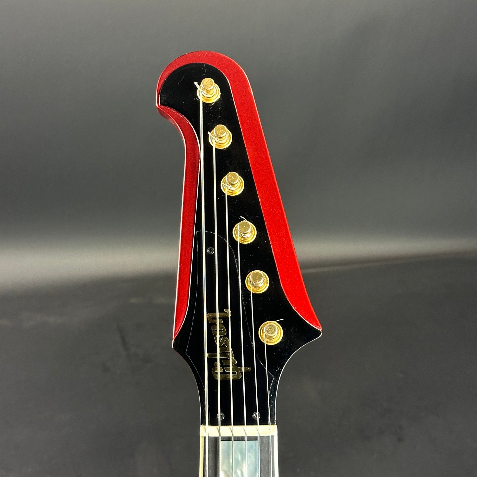 Front of headstock of Used 2006 Gibson Firebird VII Red Metallic.