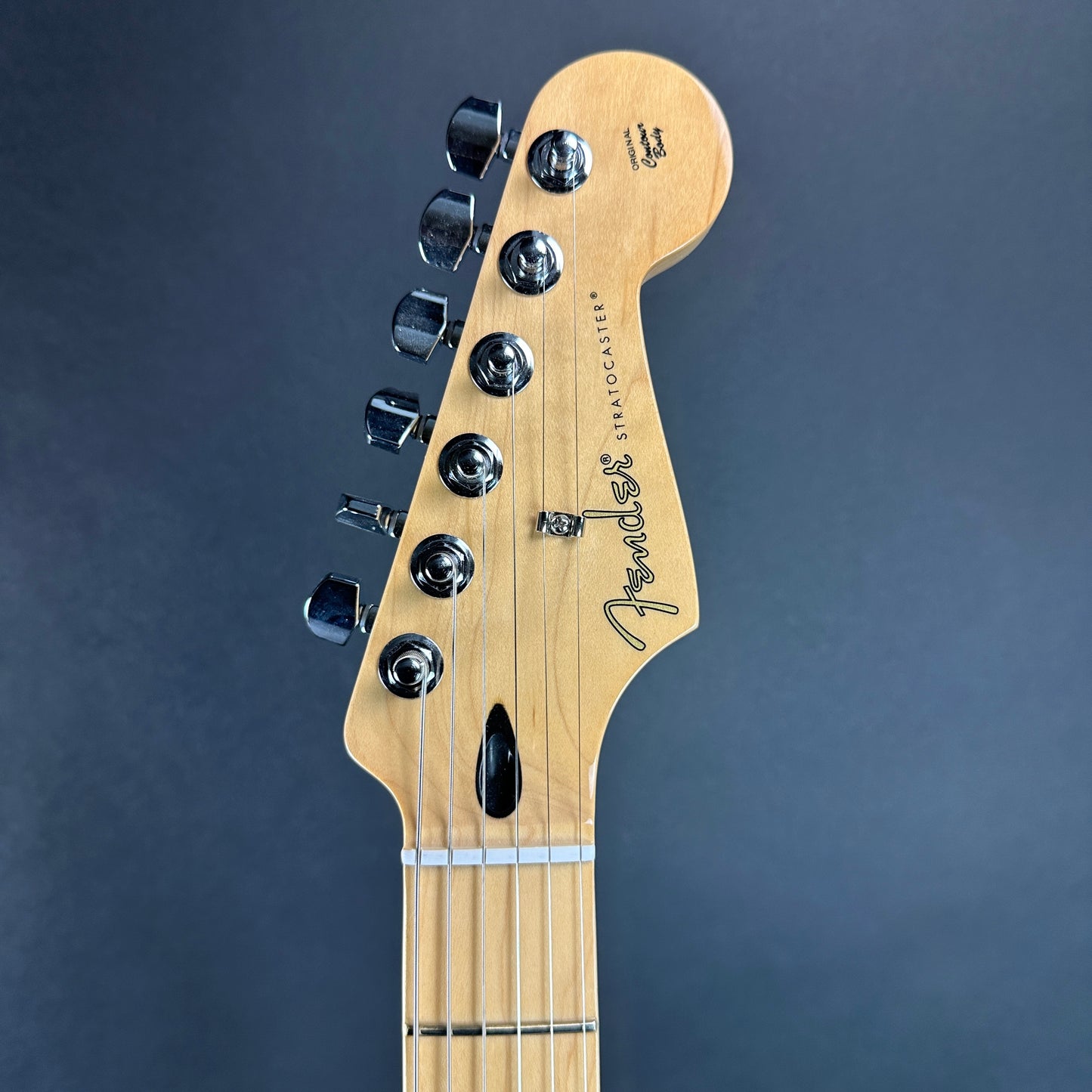 Front of headstock of Used 2024 Fender Player Stratocaster Maple 2-Tone Sunburst.