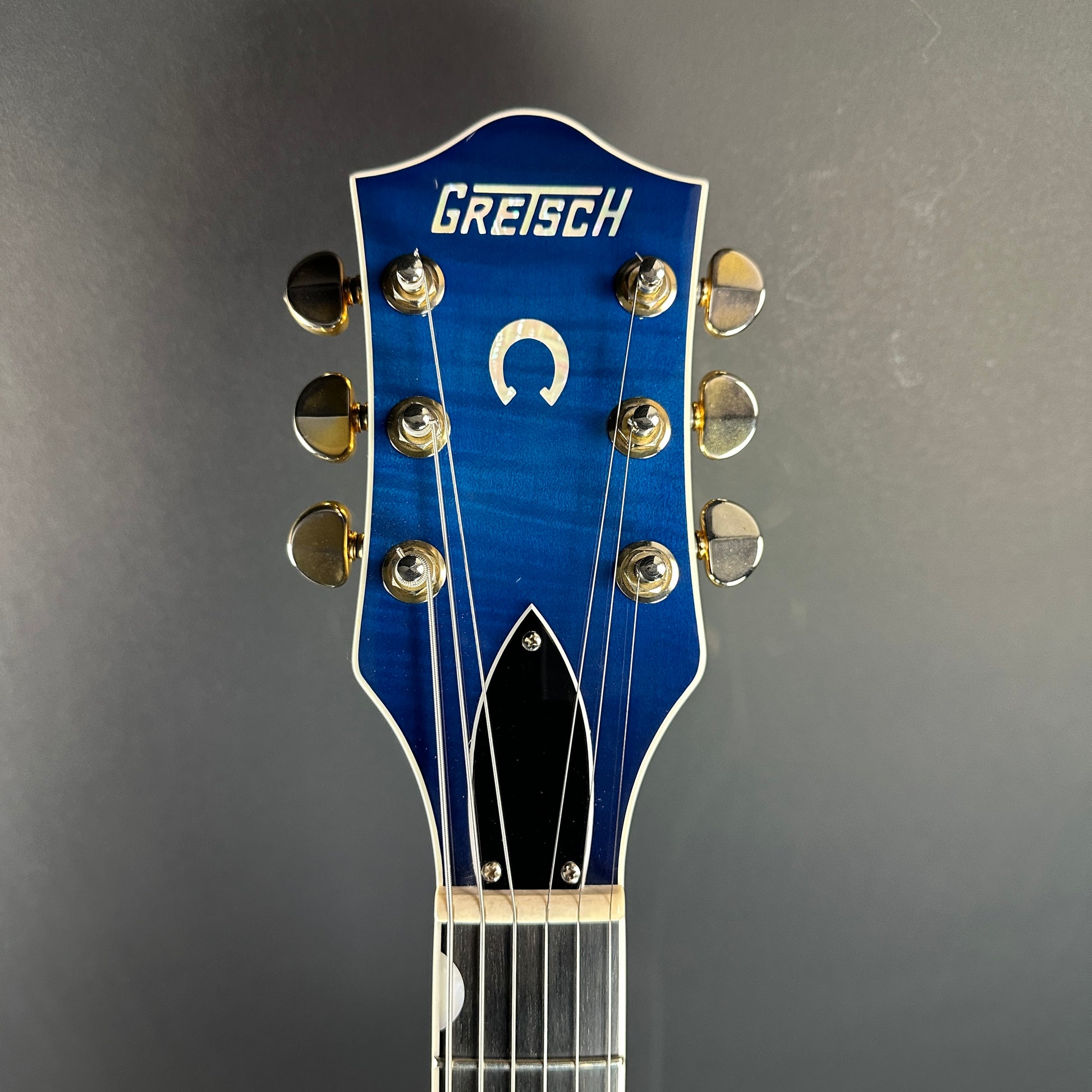 Front of headstock of Used Gretsch G6120 SB Blueburst.