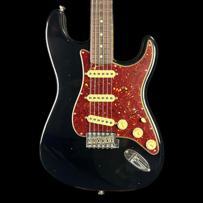 Front of body of Fender Custom Shop Postmodern Strat RW Journeyman Relic w/Closet Classic Hardware Aged Black.