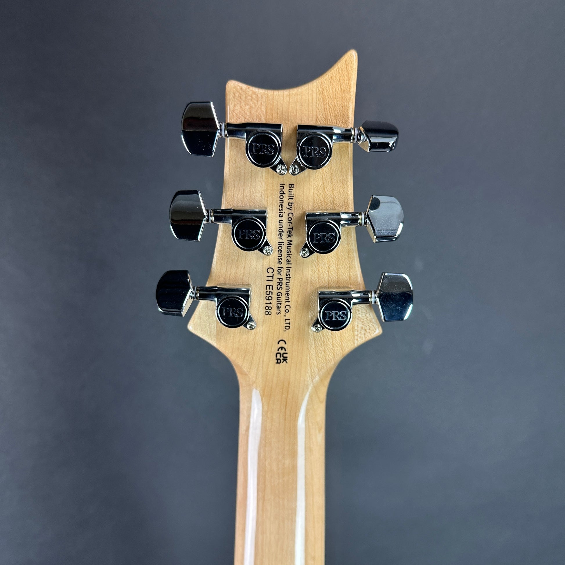 Back of headstock of Used PRS SE Custom 24 Bonnie Pink.