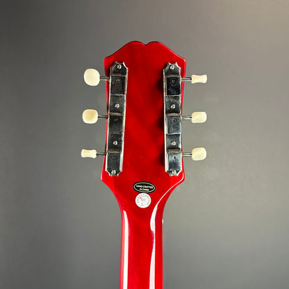 Back of headstock of Used Epiphone Coronet Cherry.