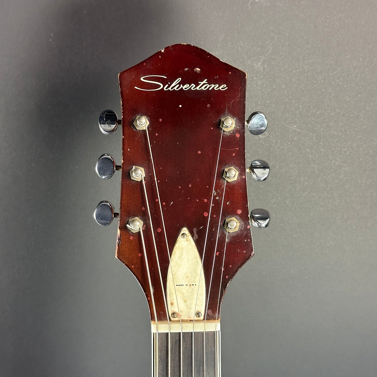 Front of headstock of Vintage Silvertone 1454 Doublecut Redburst.