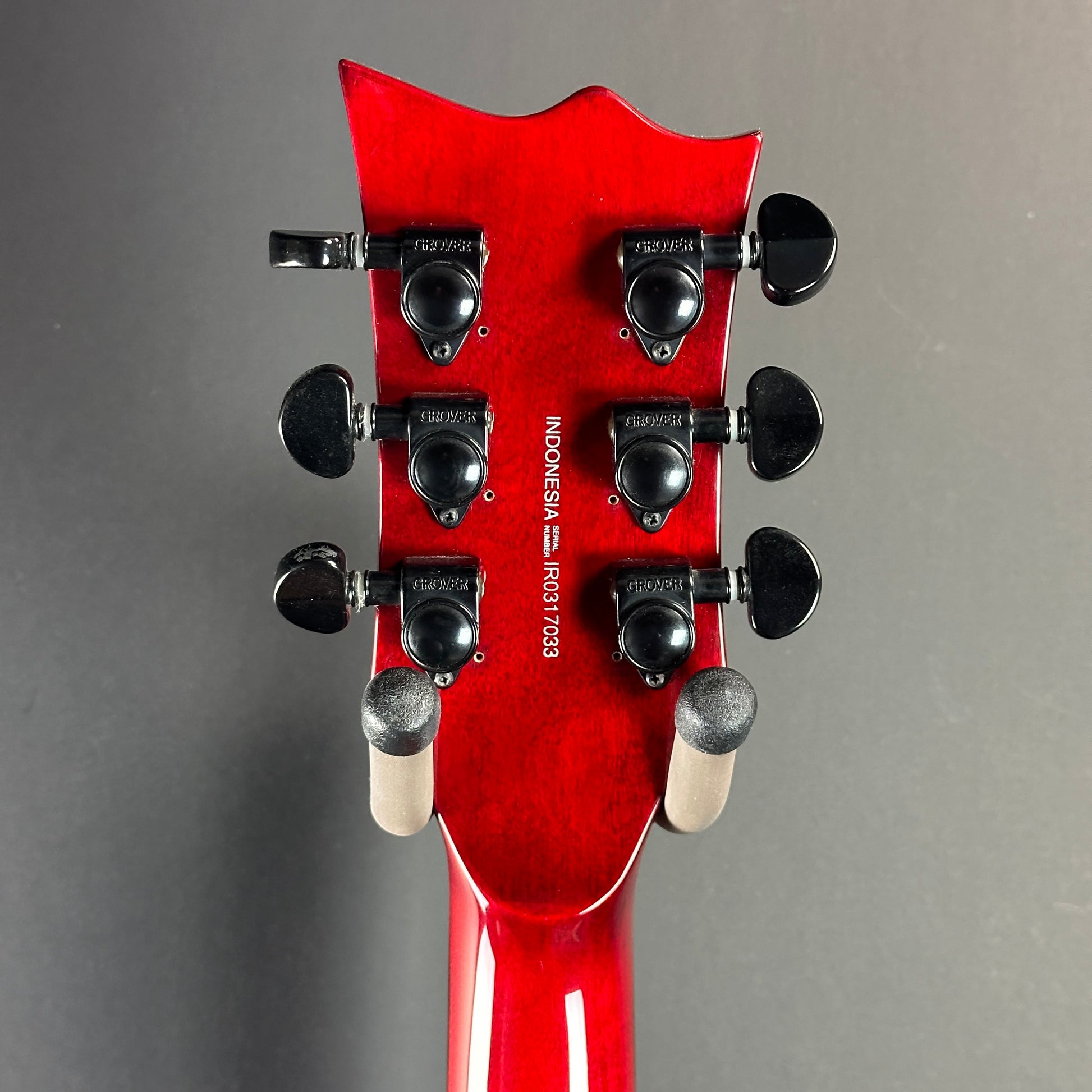 Back of headstock of Used LTD EC-100QM Fire Red.