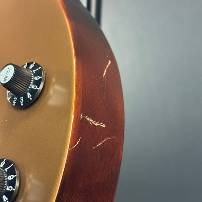 Scratches near controls of Used Gibson Les Paul 70's Tribute Gold Top.