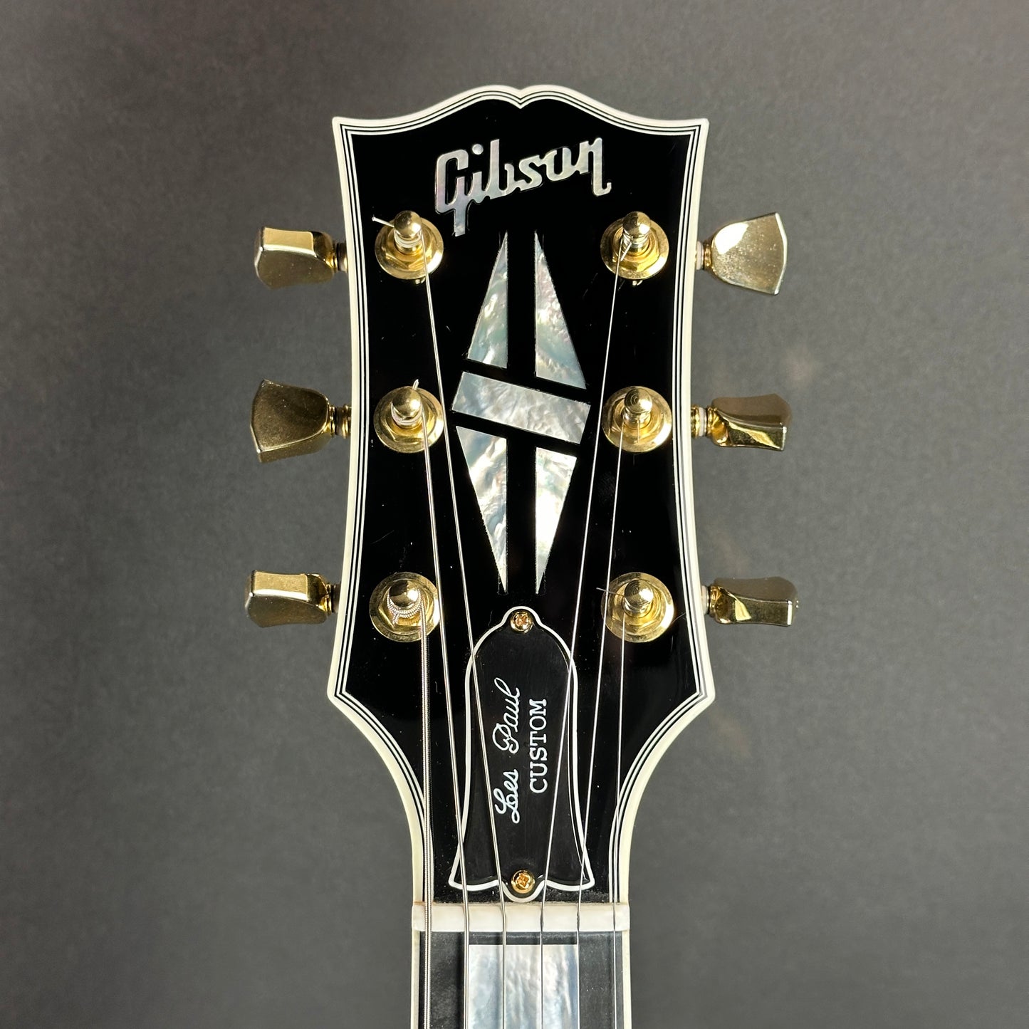 Headstock of Used Gibson Les Paul Custom Ebony.