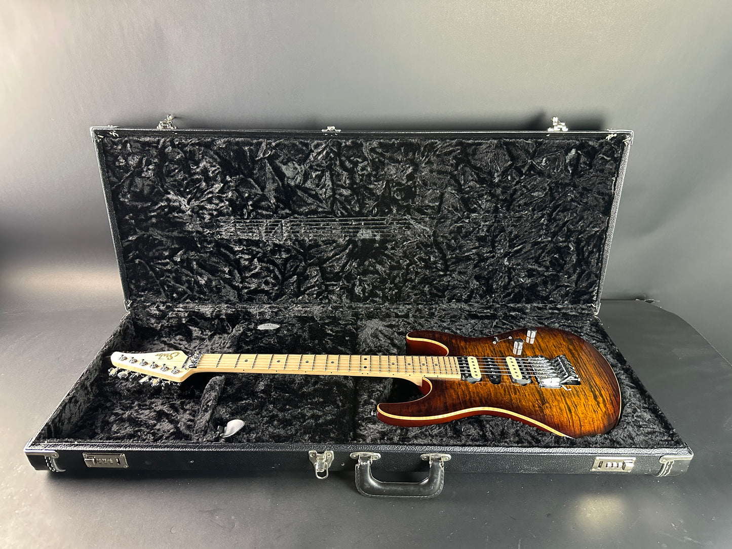 Used 2015 Suhr Modern Pro Flame Top HSH Floyd Rose in case.