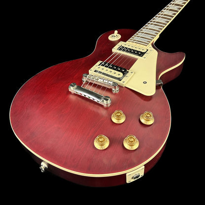 Front angle of Used Epiphone Traditional Pro IV Les Paul Worn Wine Red.