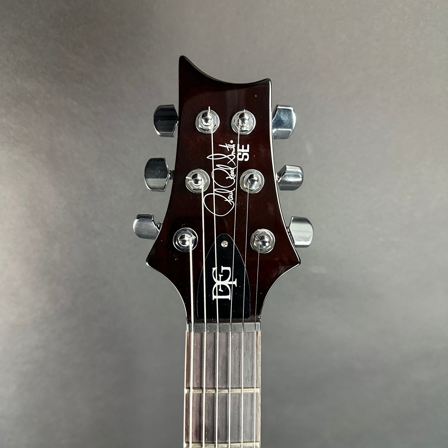 Front of headstock of Used PRS SE DGT Gold Top.