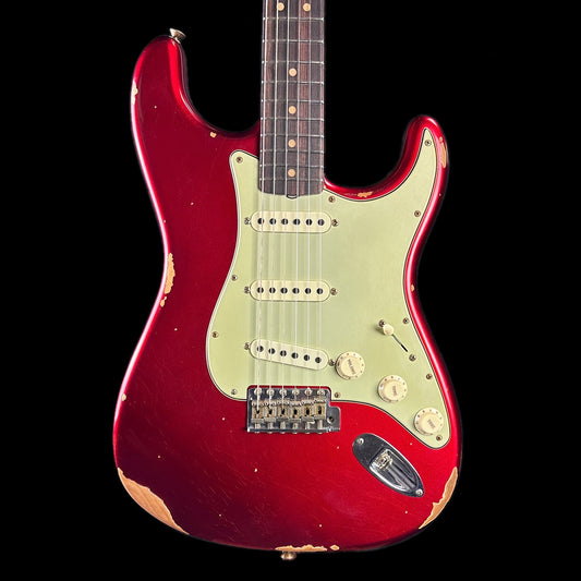 Front of body of Fender Custom Shop Limited Edition '63 Strat Relic Aged Candy Apple Red.