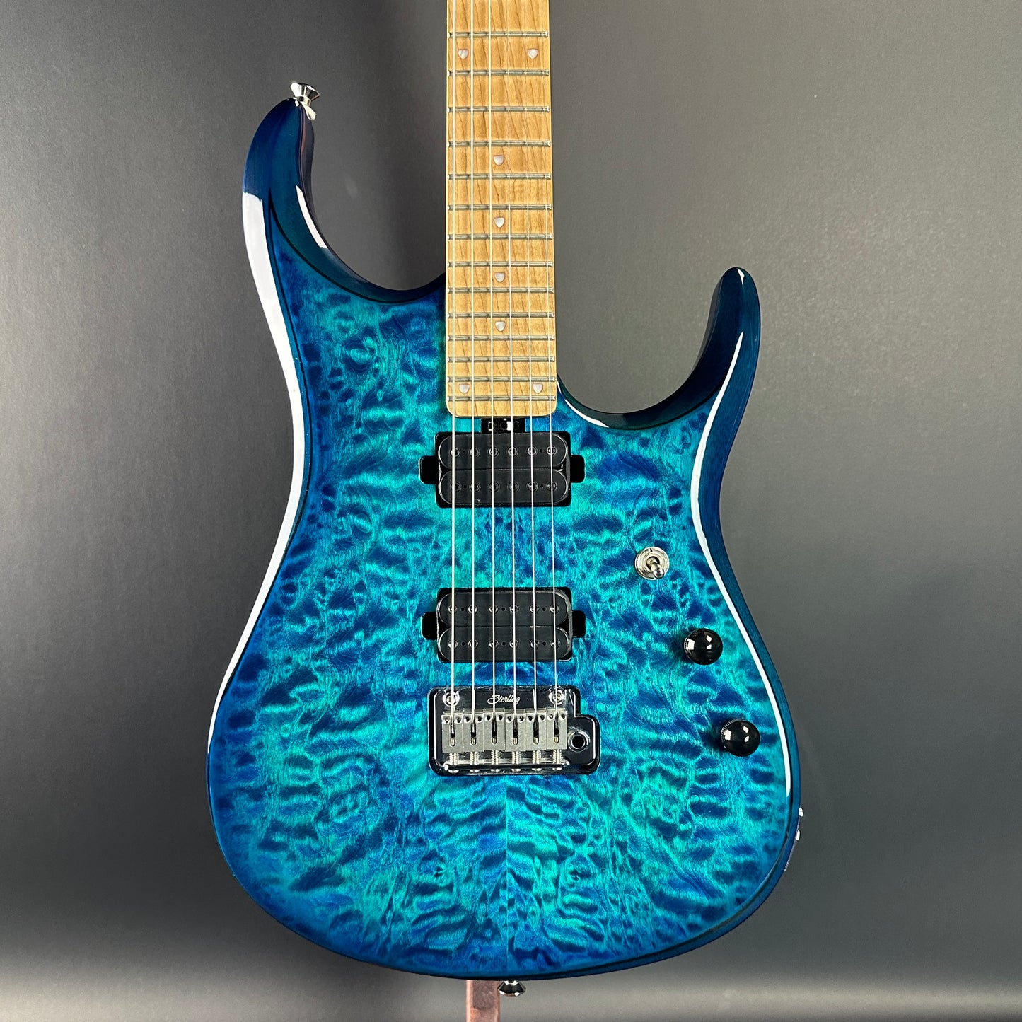 Front of Used Sterling by MusicMan John Petrucci Quilt Top Trans Blue.