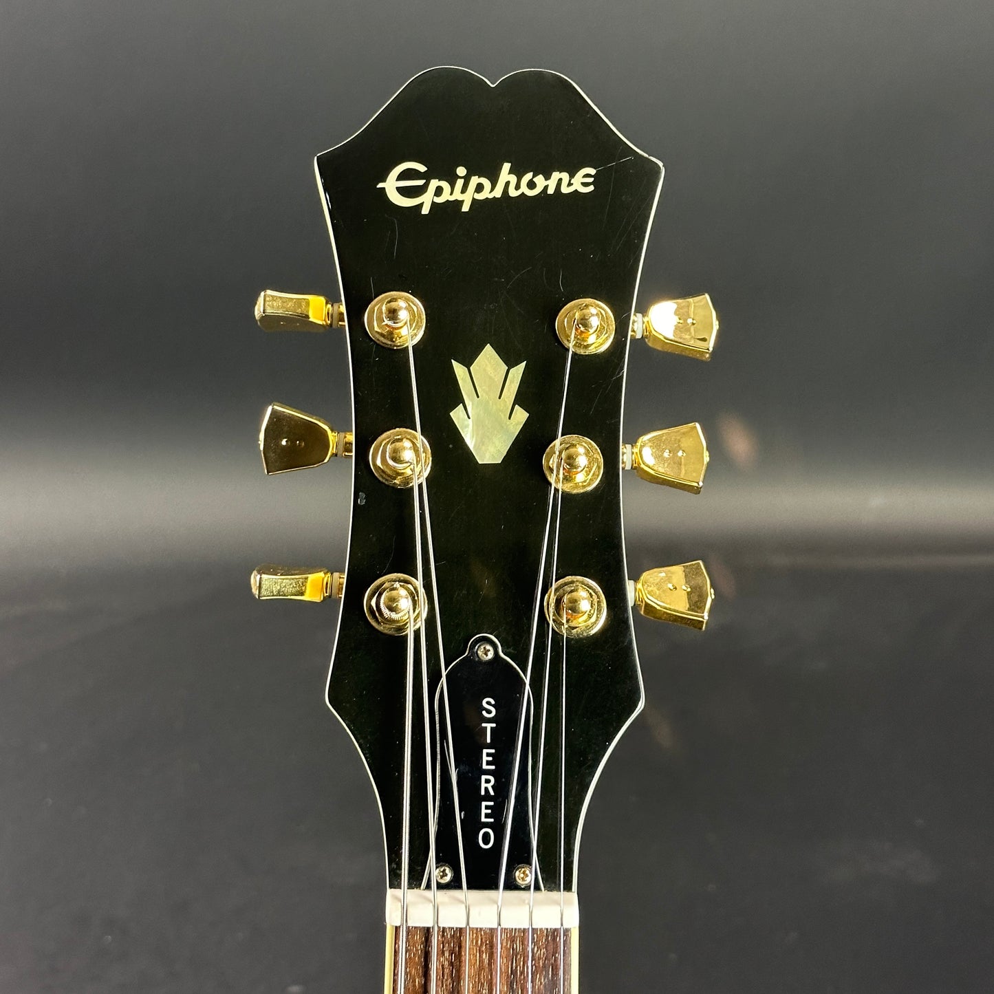 Front of headstock of Used Epiphone ES-345 Antique White.