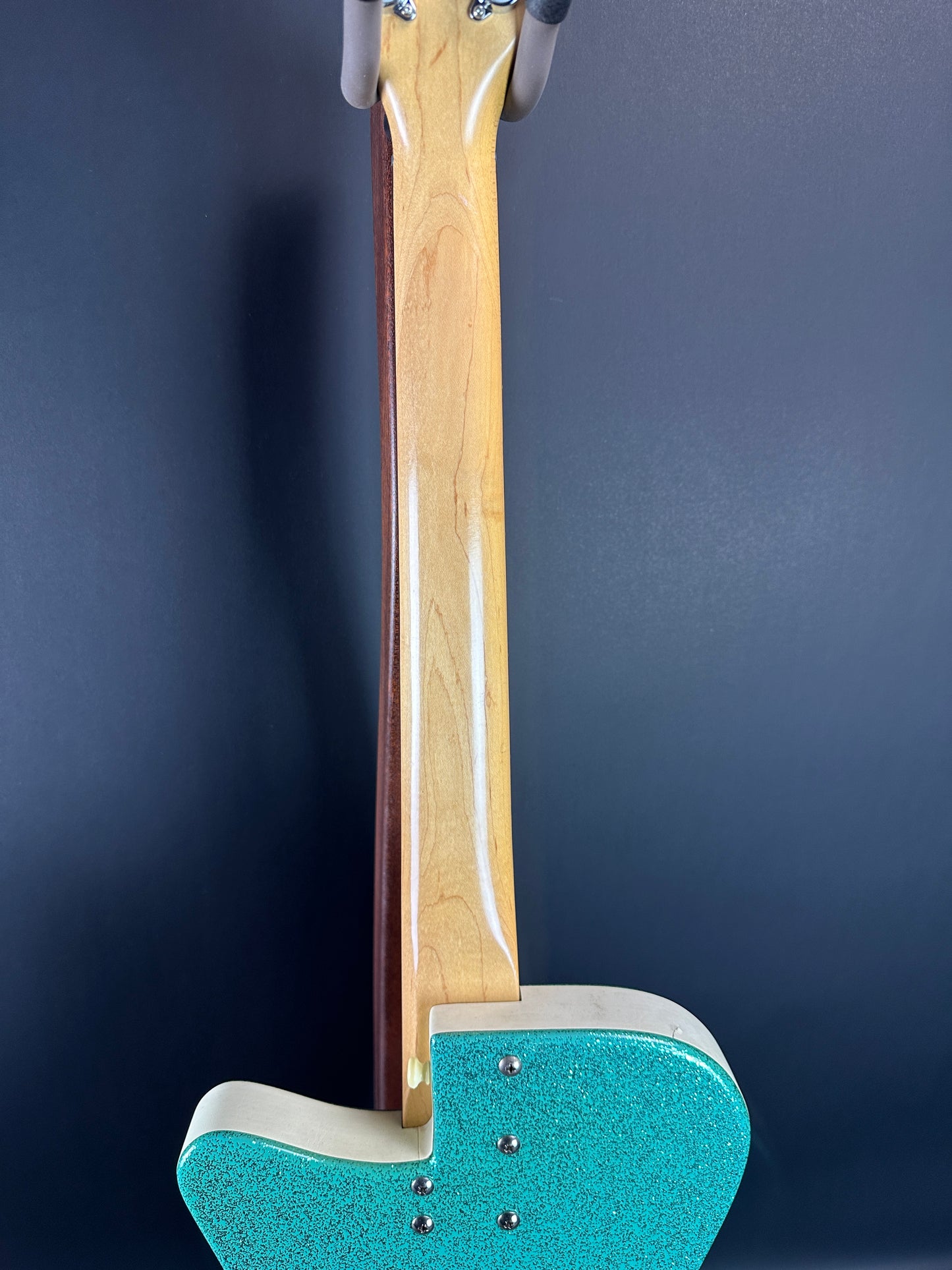 Back of neck of Used Danelectro '56 U3 Green Sparkle.