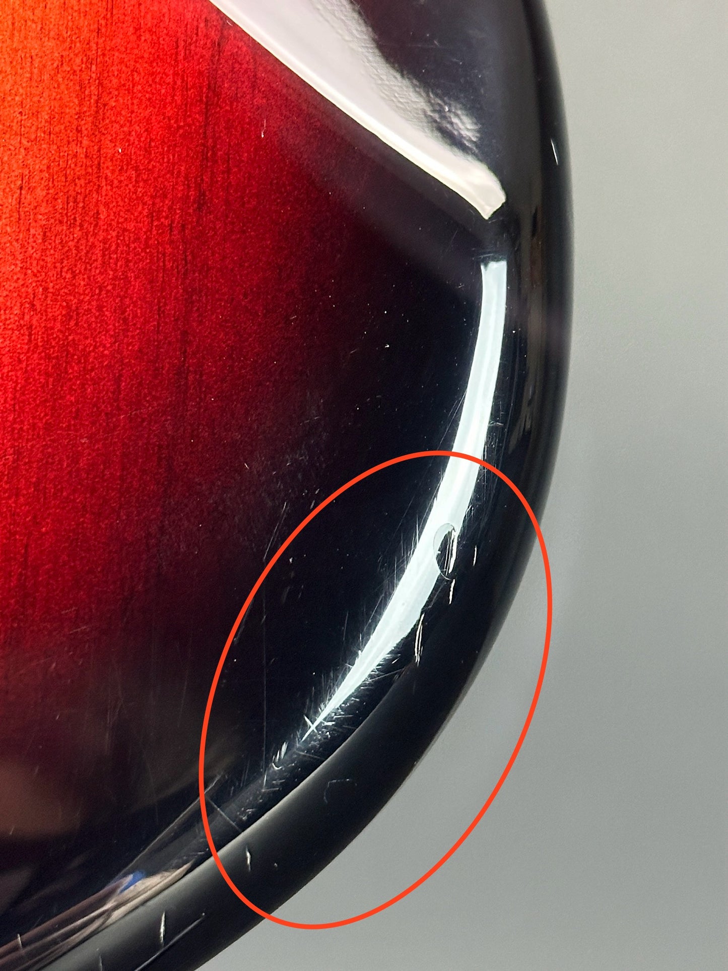 Marks on bottom edge of Used Fender American Deluxe Strat Burst.