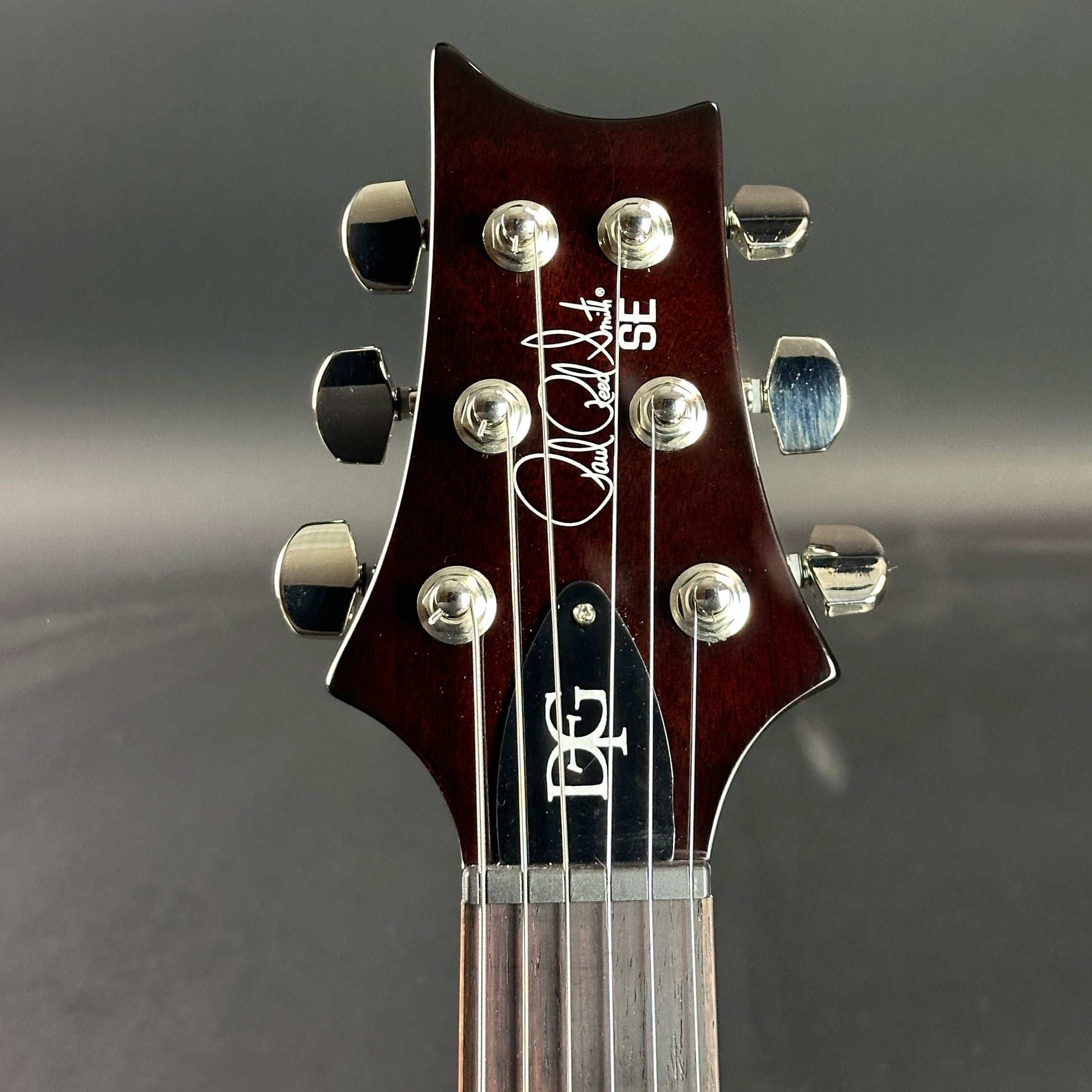 Front of headstock of Used PRS SE DGT Gold Top.