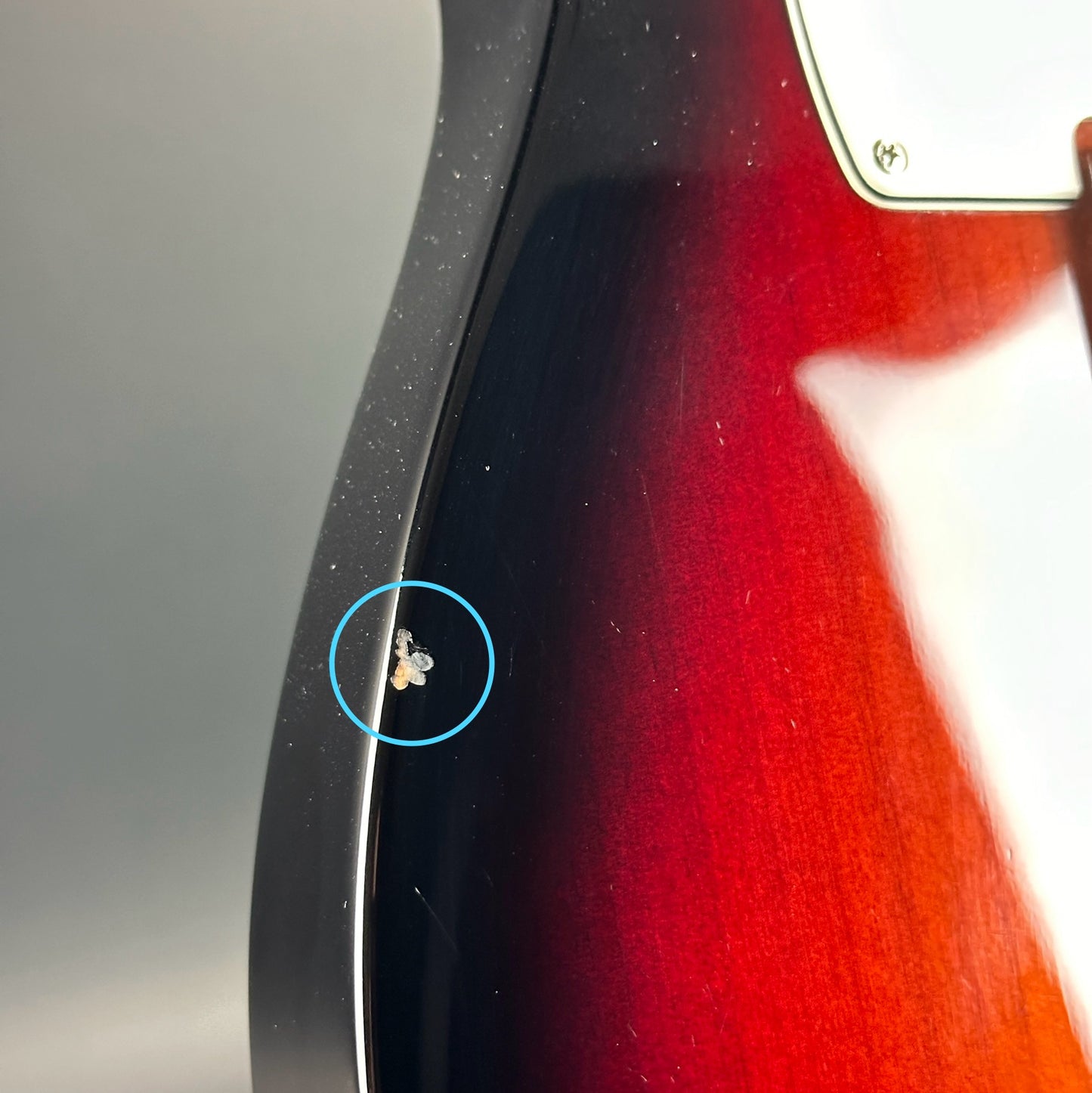 Ding on side of Used Fender American Performer Telecaster 3-Color Sunburst.