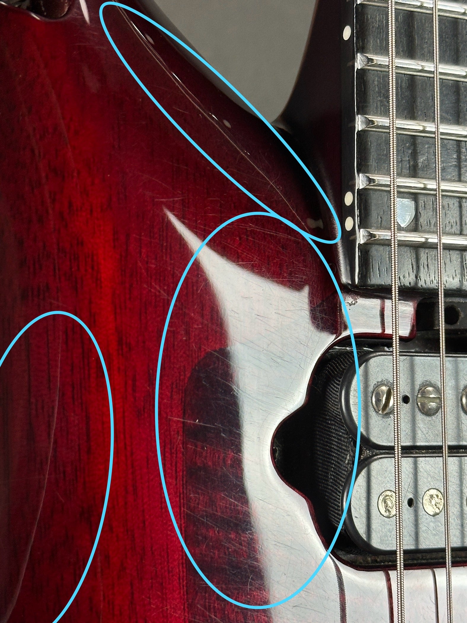 Scratches on front of Used Ernie Ball Petrucci Monarch Majesty Red.