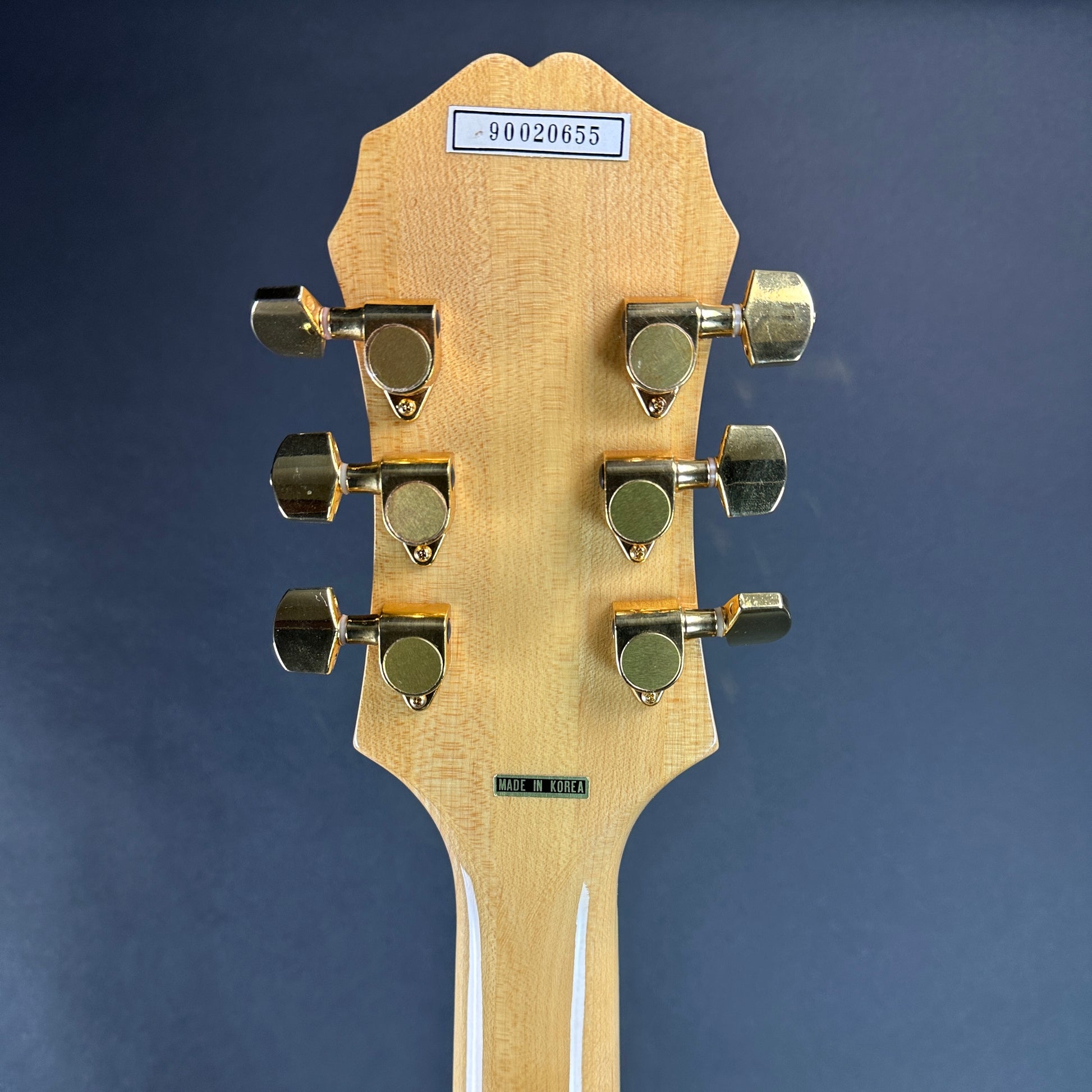 Back of headstock of Used Epiphone Emperor.