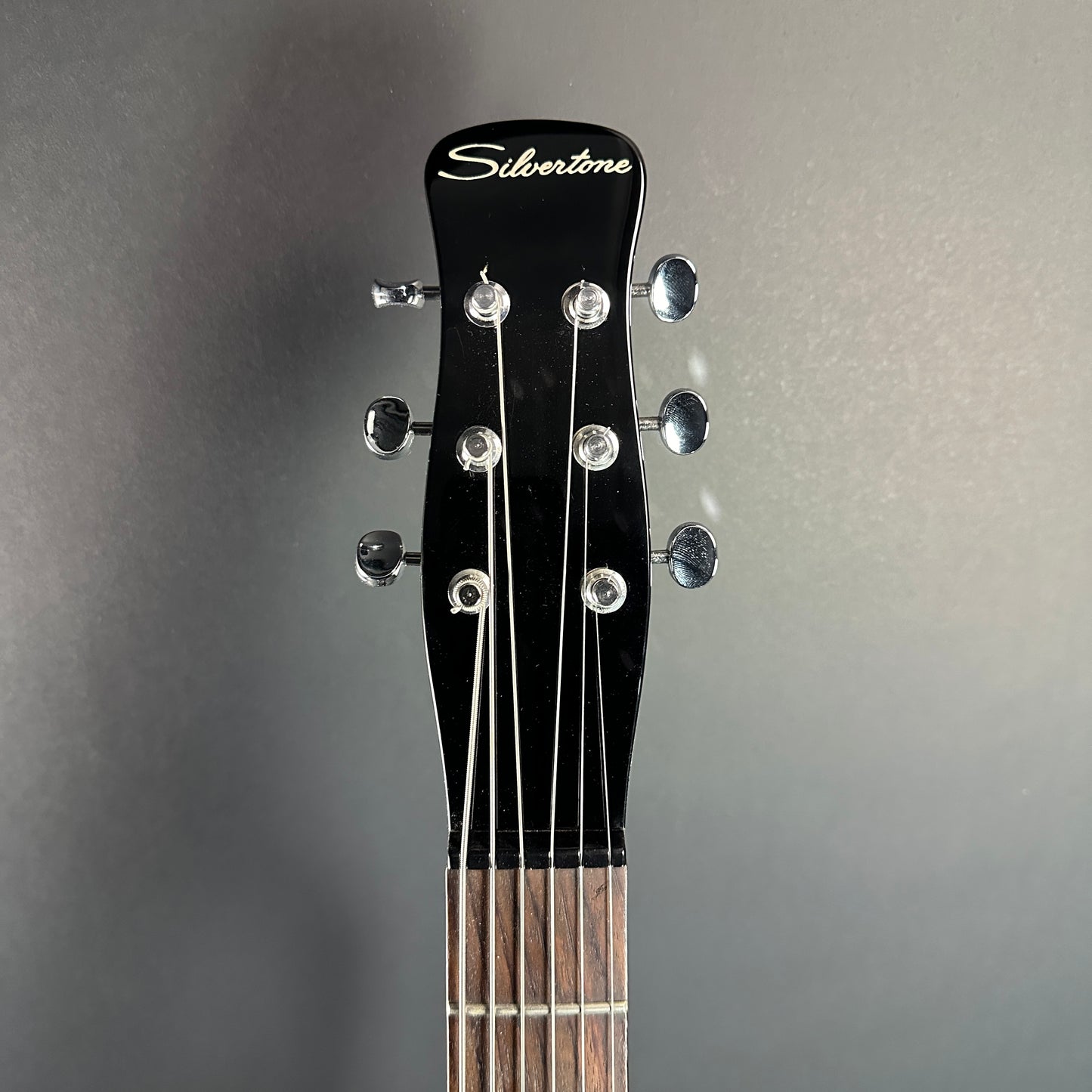 Front of headstock of Used Silvertone 1303/U2 Black.