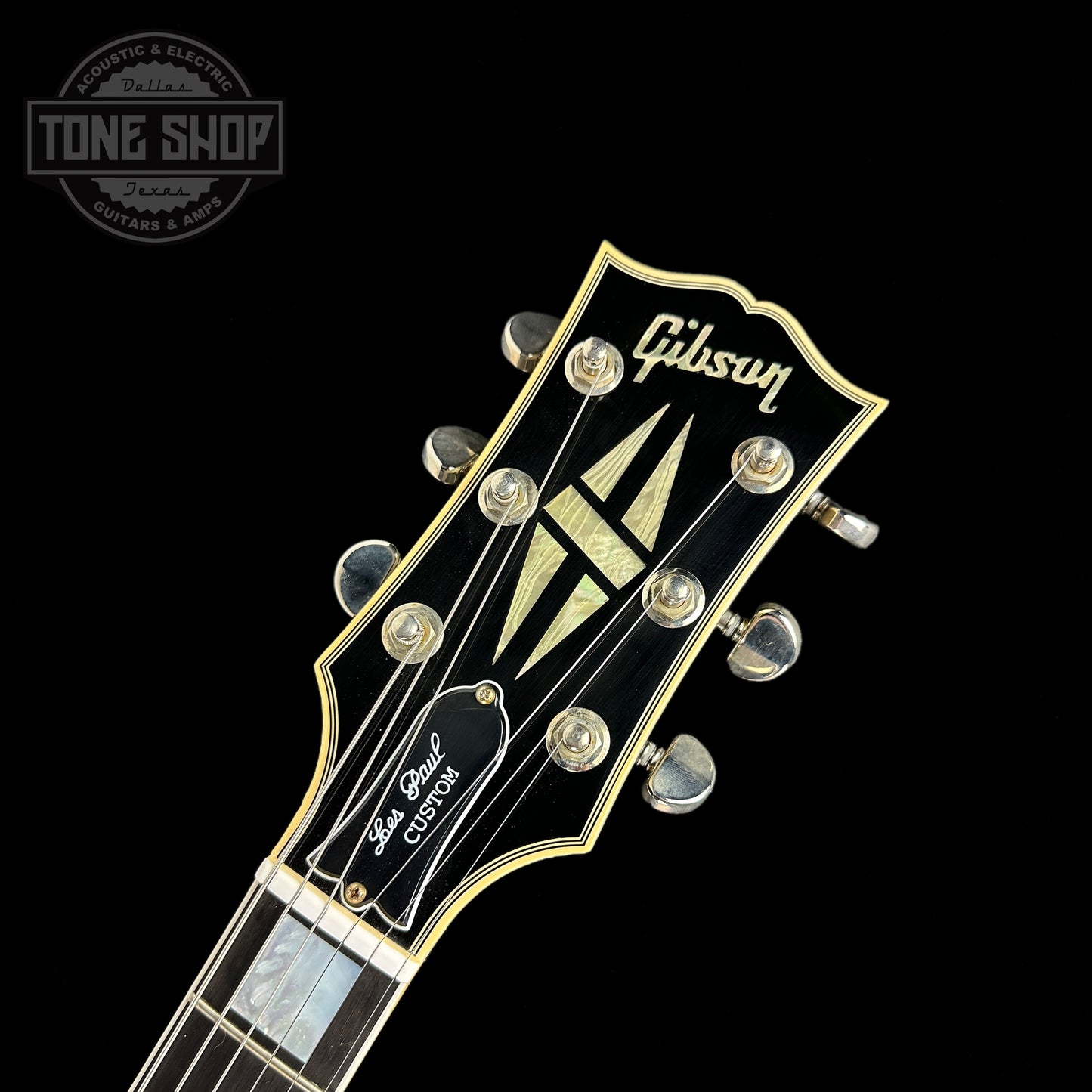 Front of headstock of Gibson Custom Shop Murphy Lab M2M Les Paul Custom Chambered Antique Silverburst Ultra Light Aged NH.