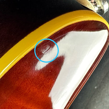 Small ding on upper horn of Used Schecter C1 Plus Diamond Sunburst.