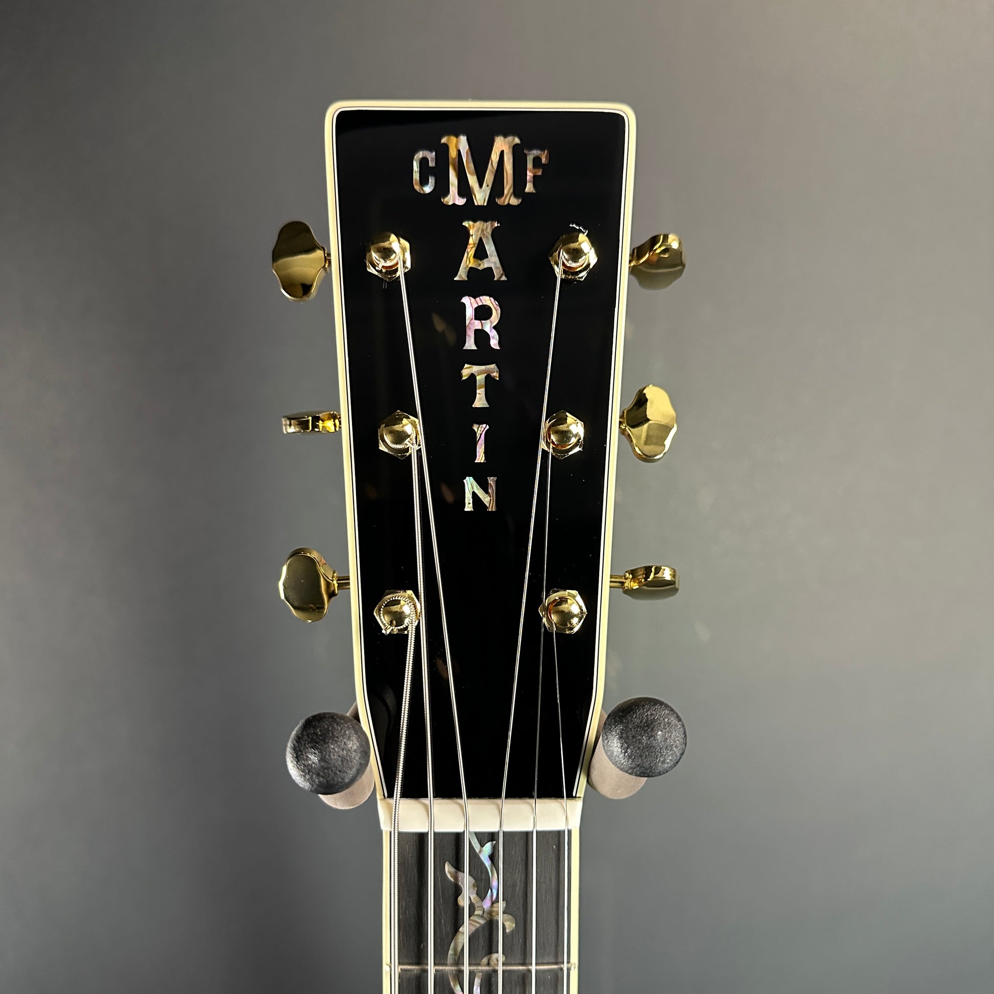 Front of headstock of Martin Custom Shop Black OM-45 Tree of Life Sitka/EIR.