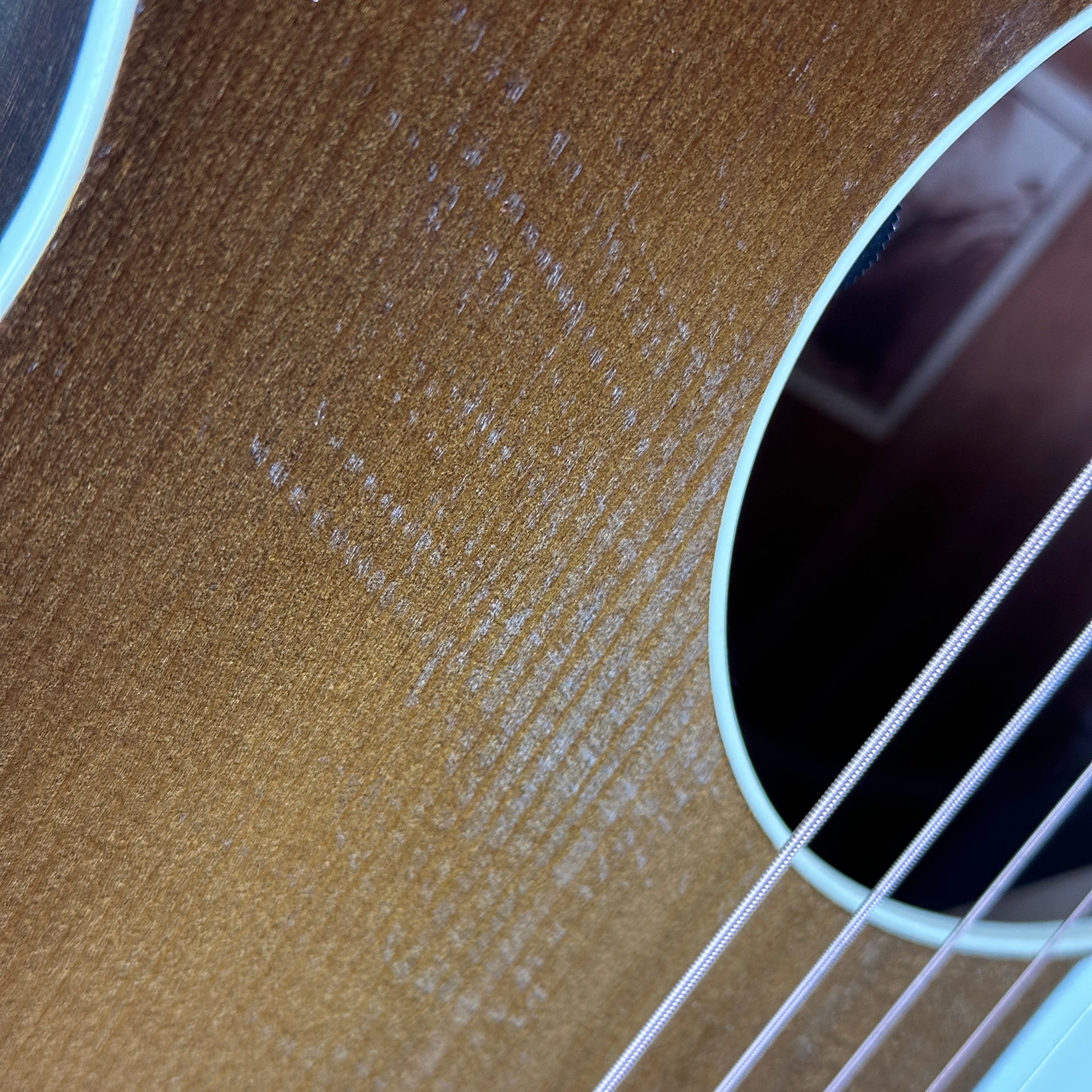 Scratches near soundhole of Used Waterloo WL14XTR.