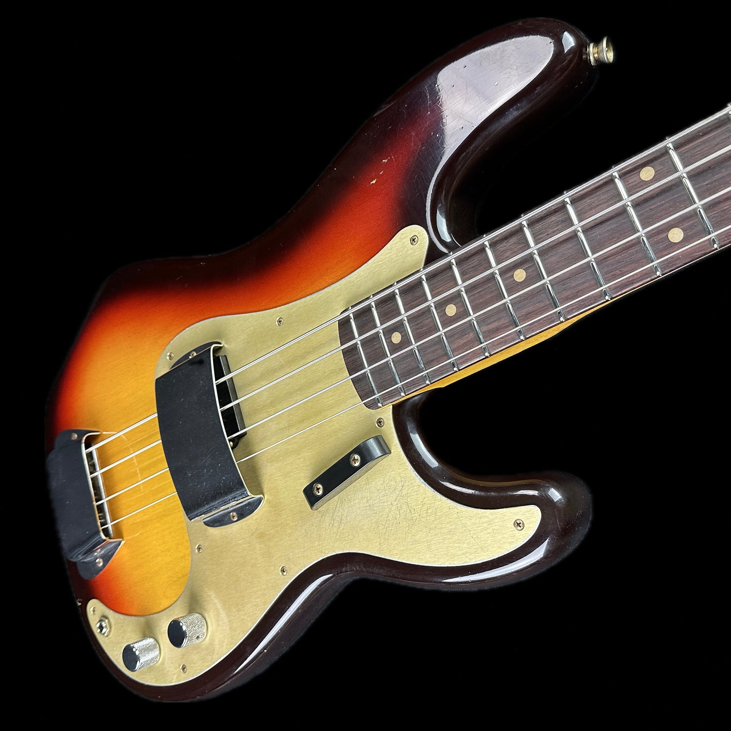 Front angle of Fender Custom Shop Limited Edition '59 Precision Bass Journeyman Relic Chocolate 3 Color Sunburst.