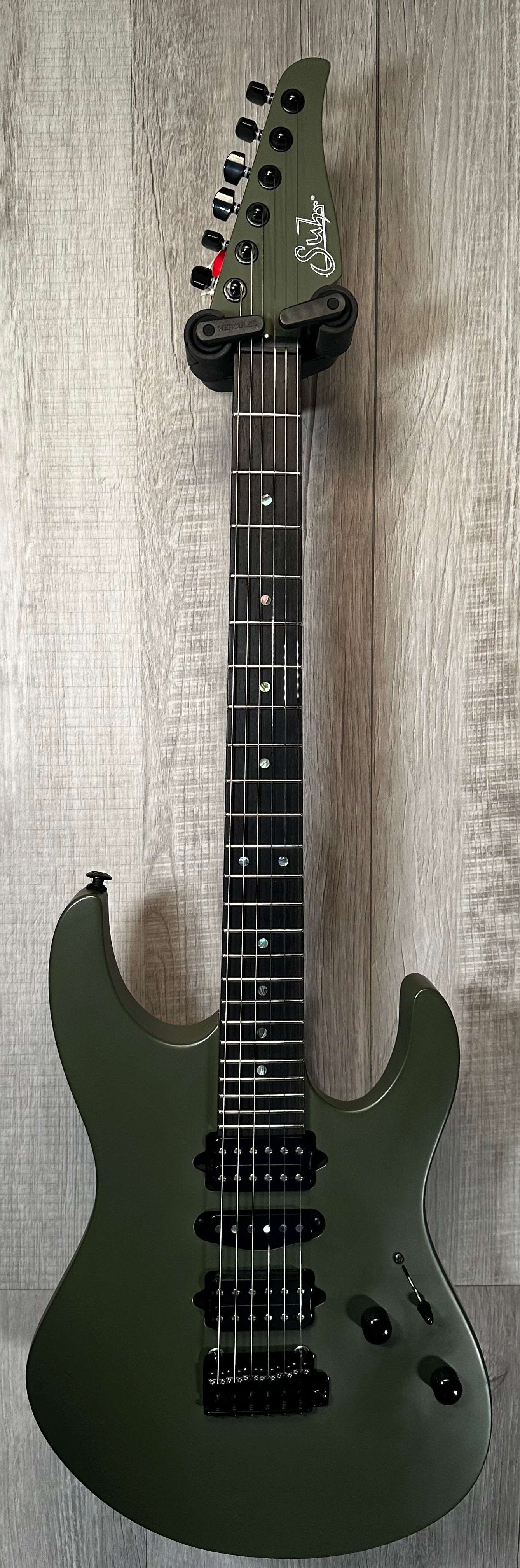 Full front of Used Suhr Modern Terra HSH Dark Forest Green w/case TSS3502