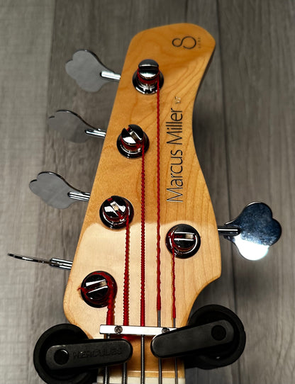 Back of headstock view of Used 2022 Sire Marcus Miller V7 5 String Bass Bright Red Metallic w/bag 