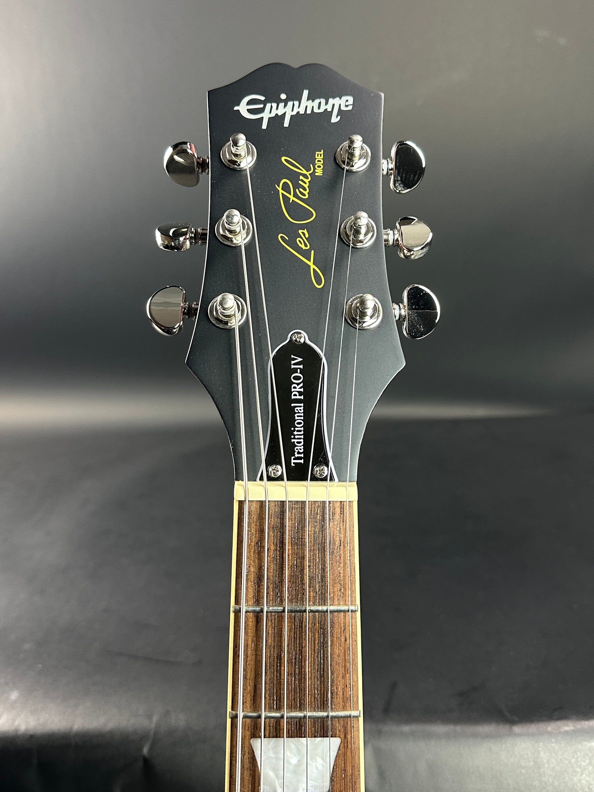 Headstock of Used Epiphone Les Paul Trad Pro IV Wine.