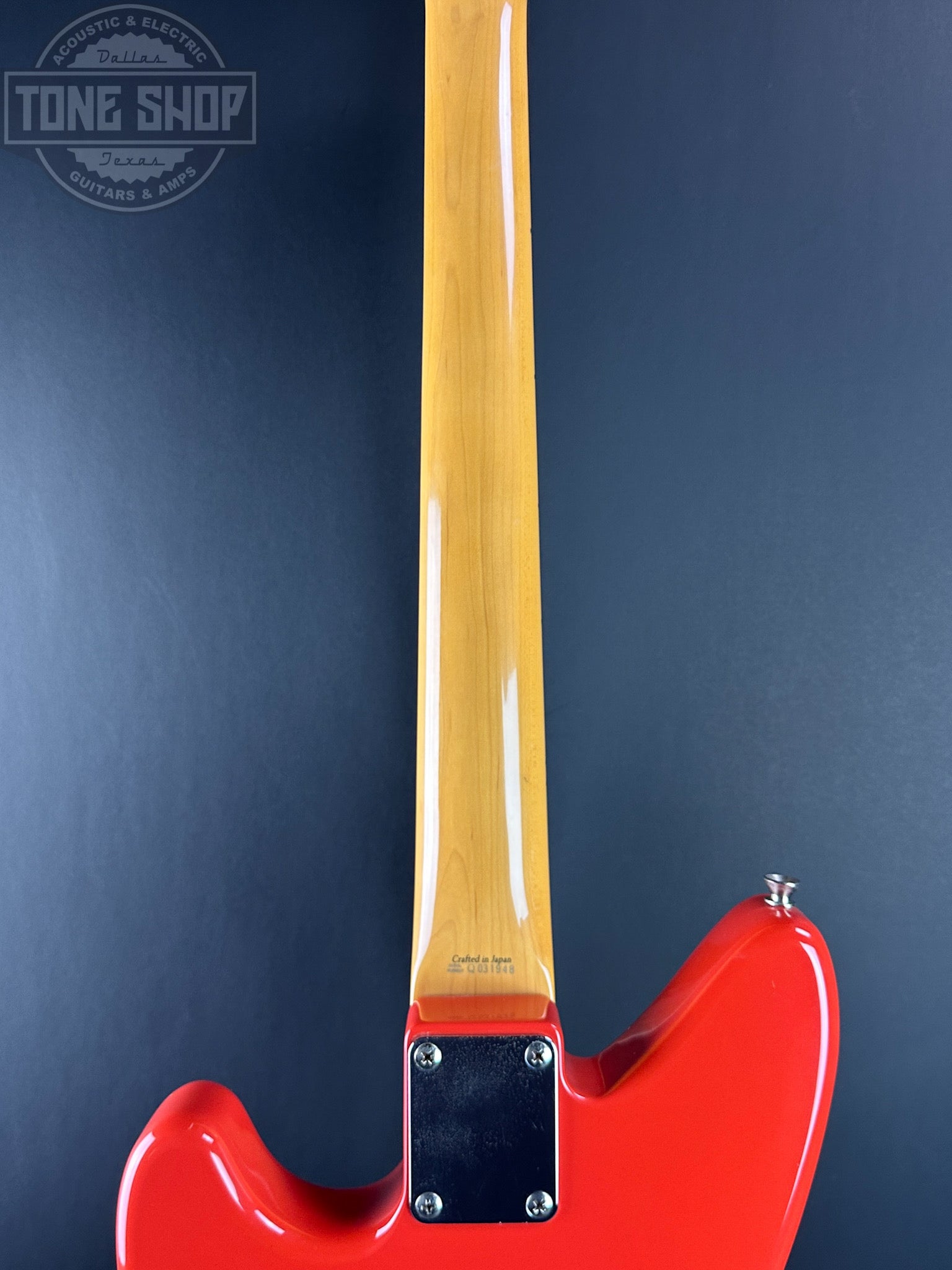 Back of neck of Used 2003 Fender MIJ Jag-Stang Fiesta Red.