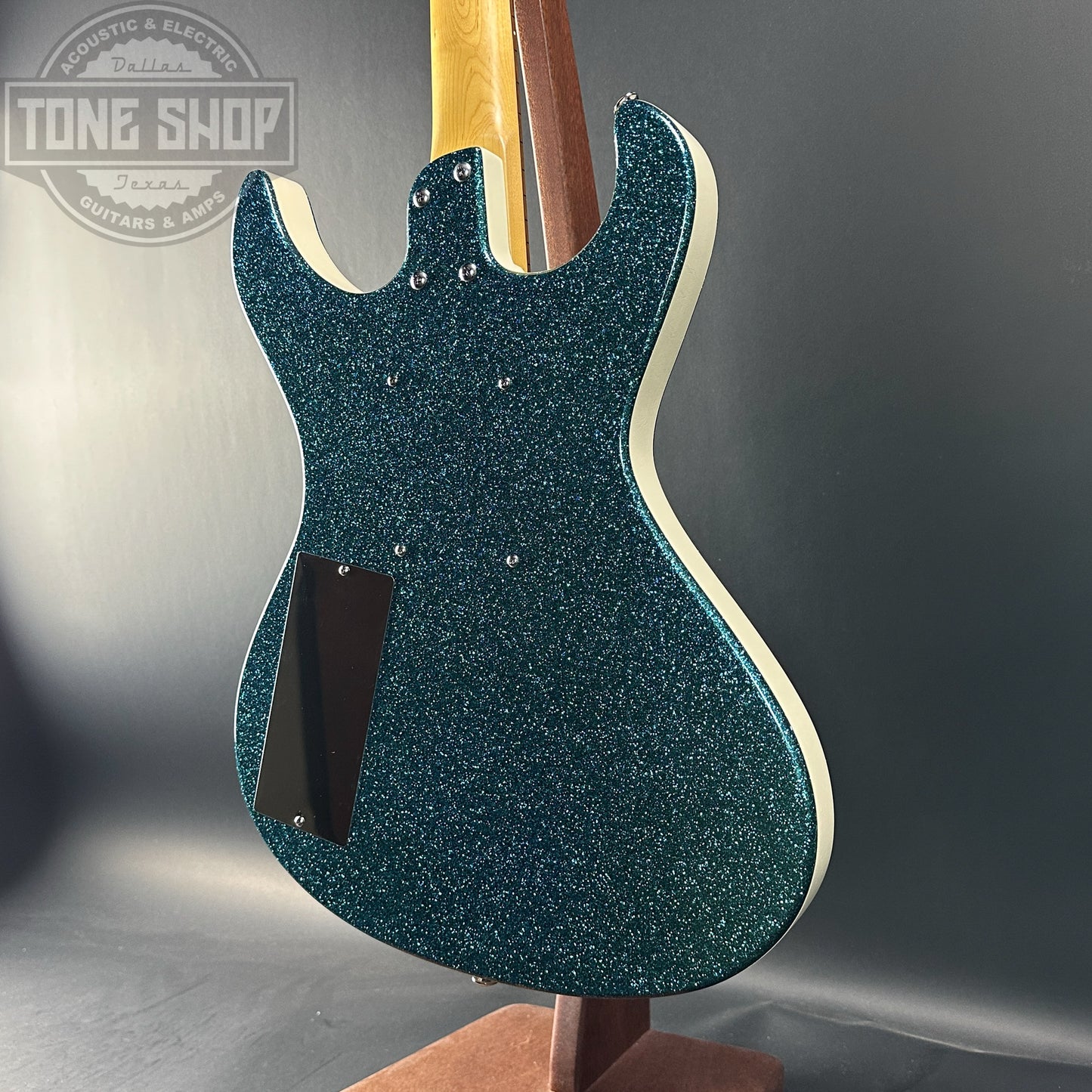 Back angle of Used Danelectro Hodad Green Sparkle.