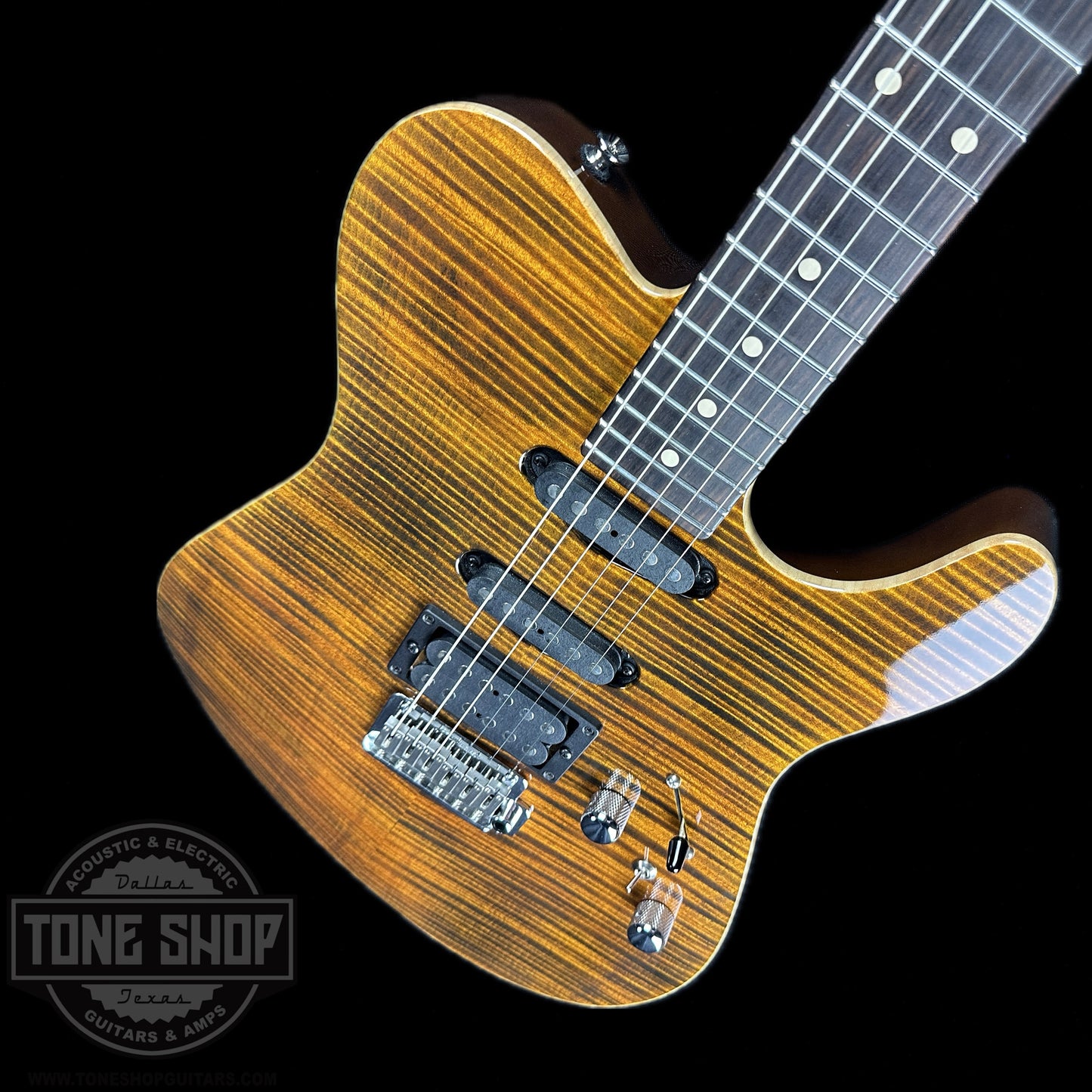 Front angle of Used Tom Anderson Hollow T Drop Top Tiger Eye.