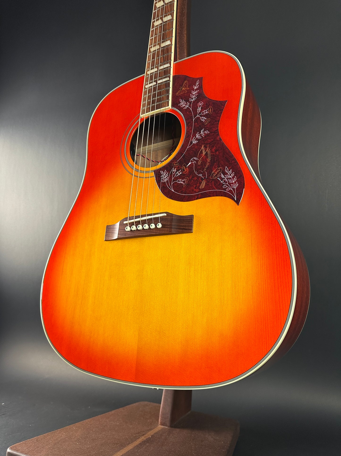 Front angle of Used Epiphone Hummingbird Studio AE Cherry Burst.