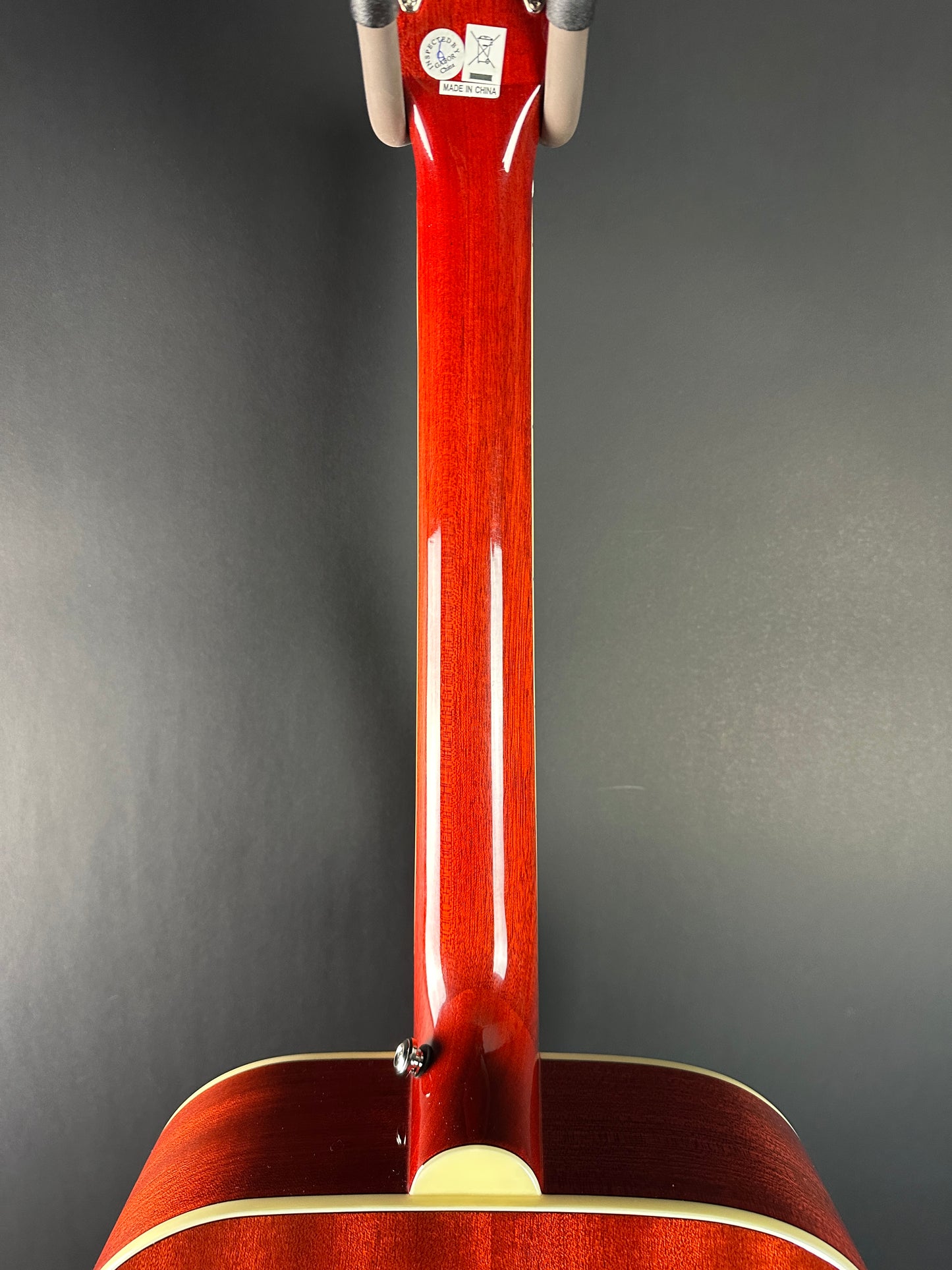 Back of neck of Used Epiphone Hummingbird Studio AE Cherry Burst.