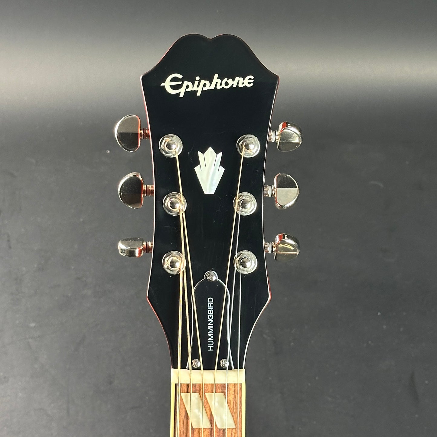 Headstock of Used Epiphone Hummingbird Studio AE Cherry Burst.