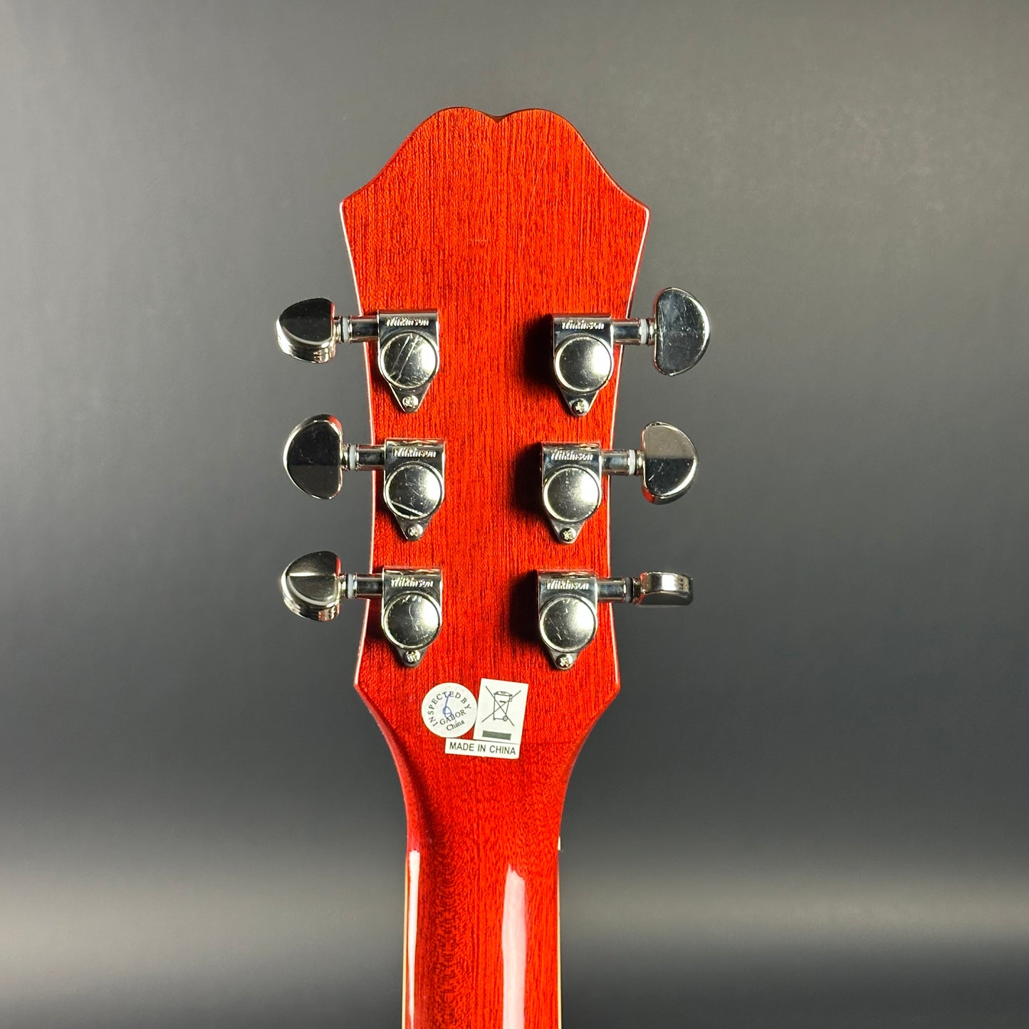 Back of headstock of Used Epiphone Hummingbird Studio AE Cherry Burst.