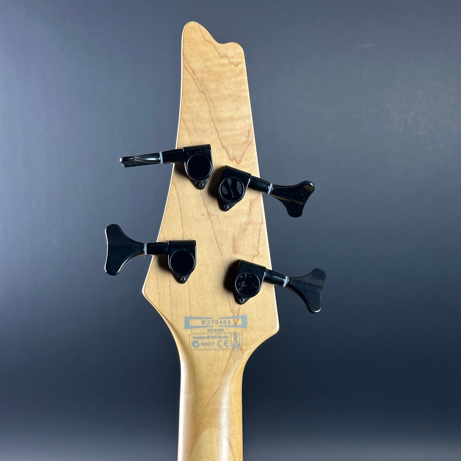 Back of headstock of Used Ibanez Iceman ICB300EX Bass Black.