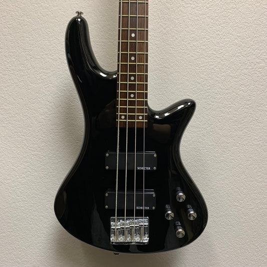 Front of Used Schecter Diamond Series Deluxe 4  Bass Black TFW4