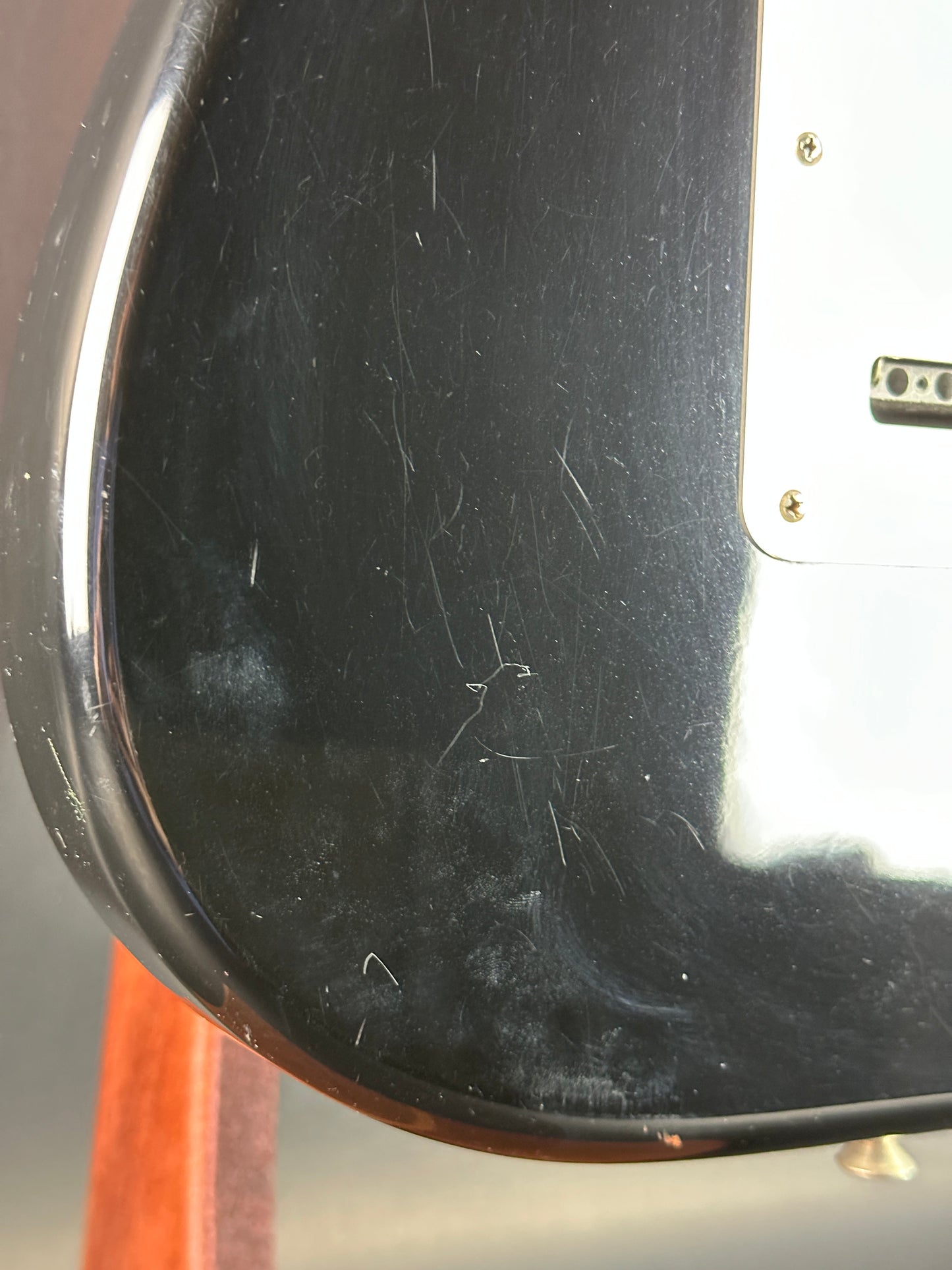 Scratches on back of Used Fender MIM Standard Strat Black.