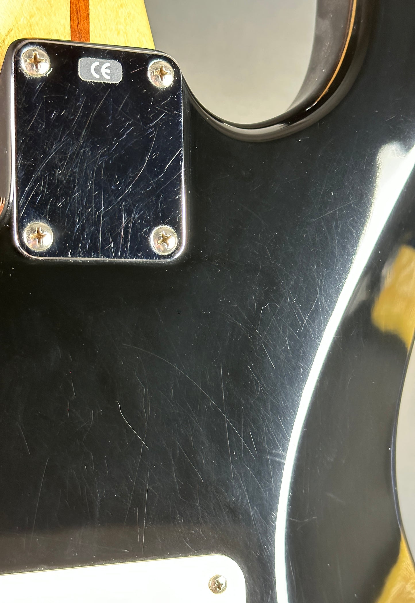 Scratches on back of Used Fender MIM Standard Strat Black.