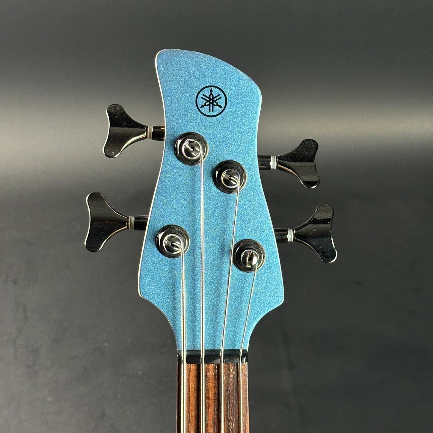 Headstock of Used Yamaha TRBX304 Bass Blue.