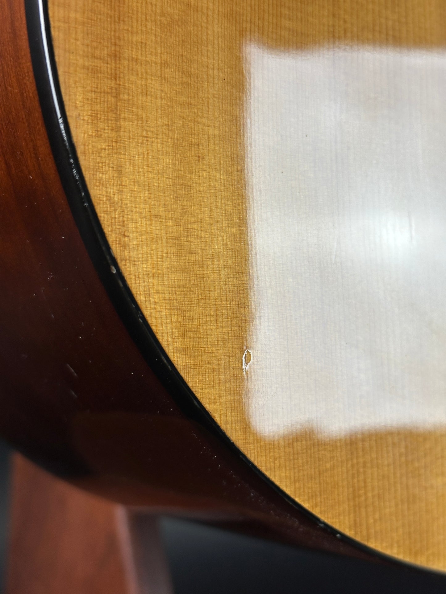 Dent on body of Used Epiphone PR-150 Acoustic Natural.