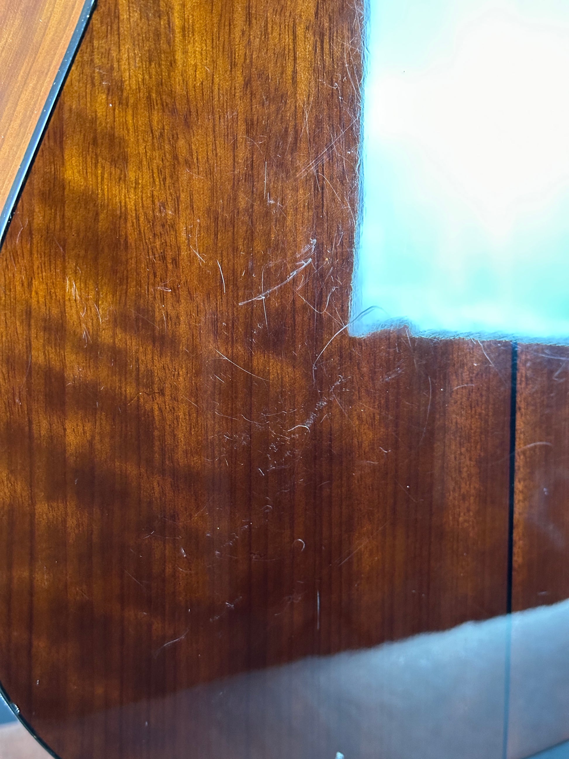 Scratches on back of Used Epiphone PR-150 Acoustic Natural.