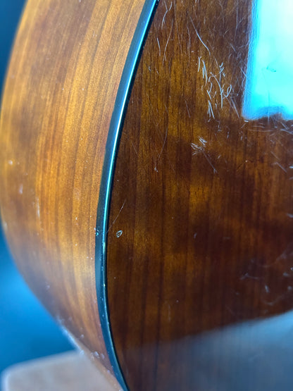 Scratches on back of Used Epiphone PR-150 Acoustic Natural.