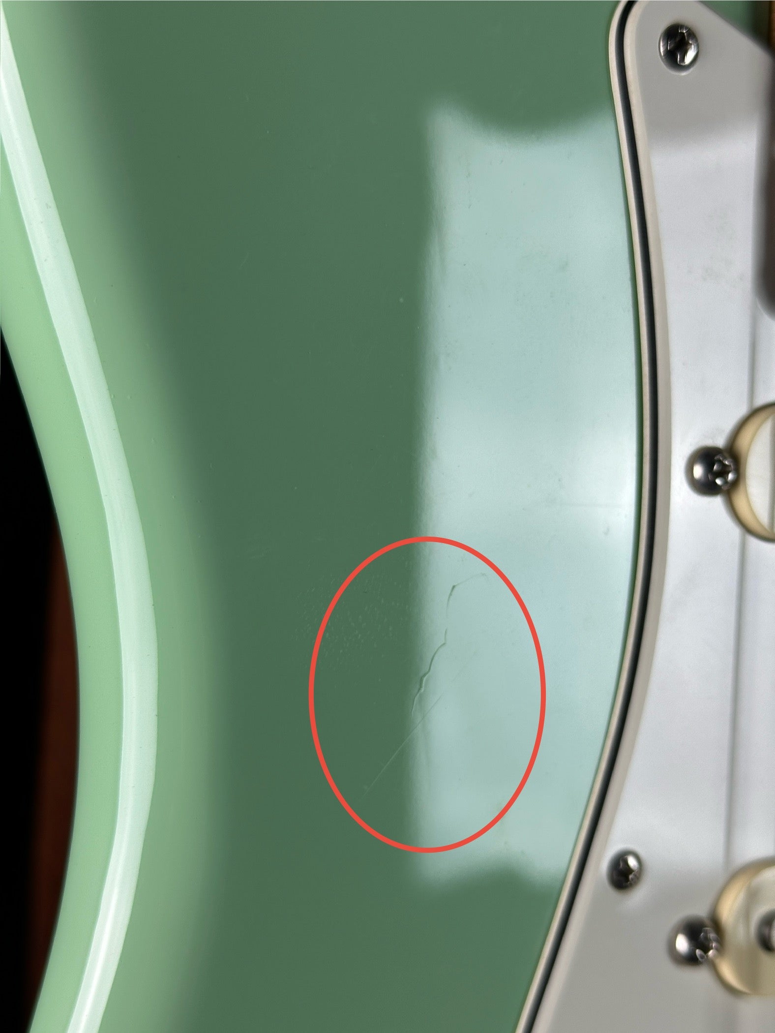 Scratch on front of Used Fender American Professional II Surf Green Roasted Neck.