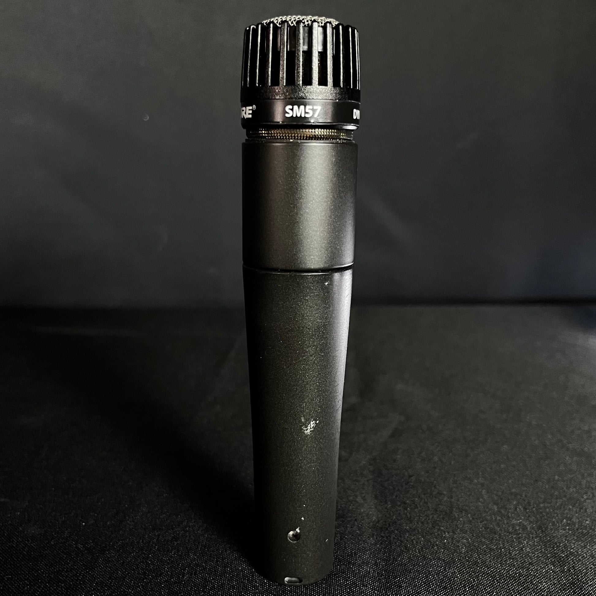 Front of Used Shure SM57 Microphone w/clip & Bag TFW244