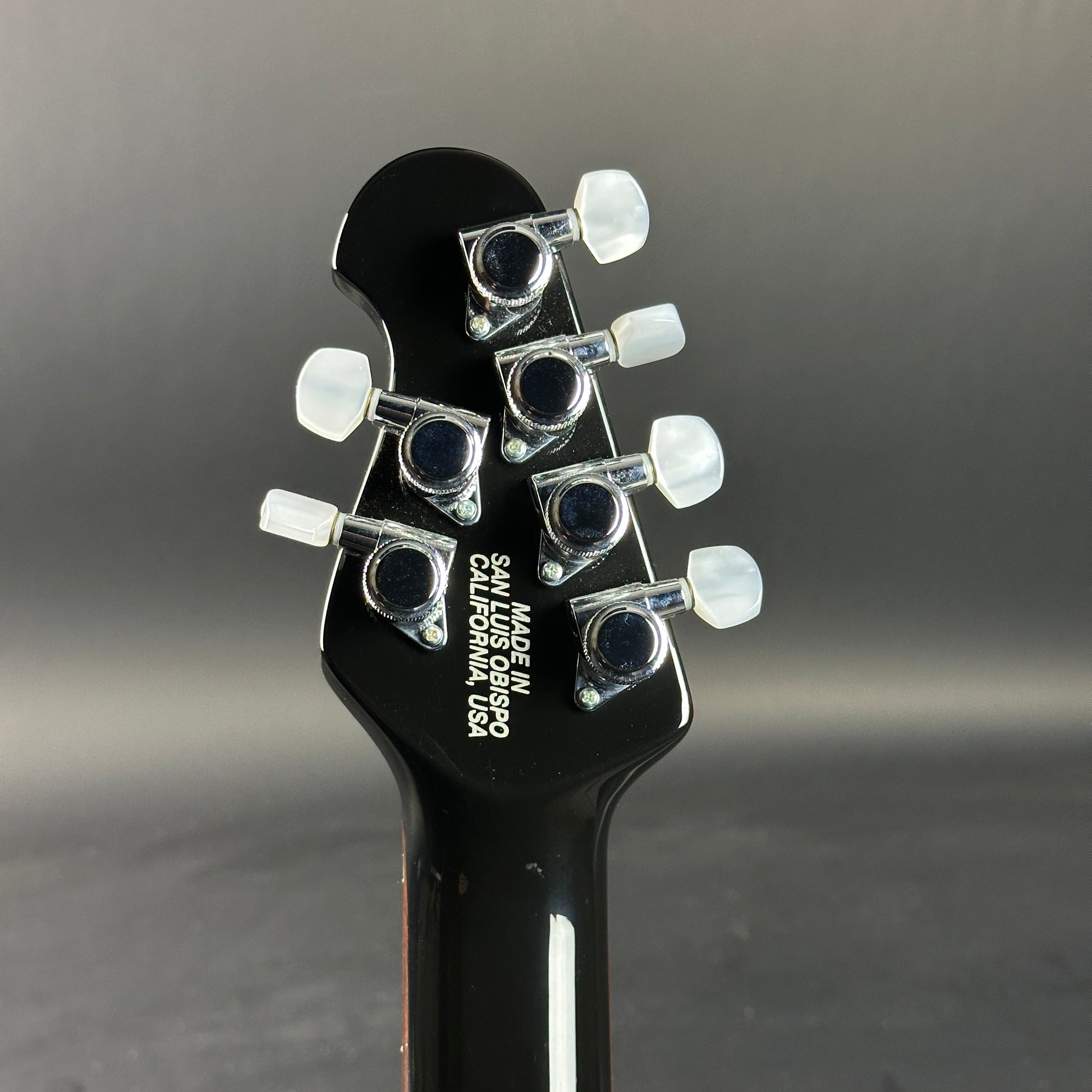 Back of headstock of Used 2007 Ernie Ball Family Reserve Petrucci Black Sunburst.